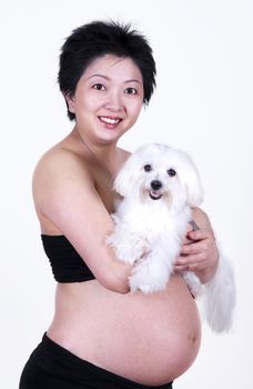 Pregnant Asian Woman Holding a Dog