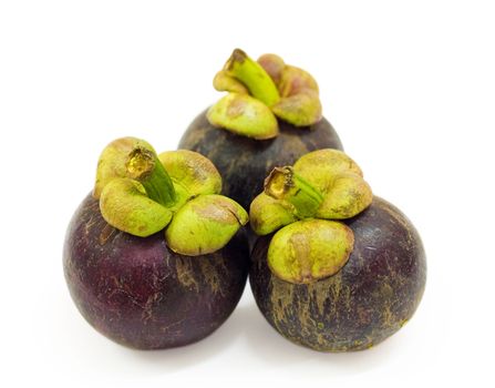 Three Mangosteens on white background.