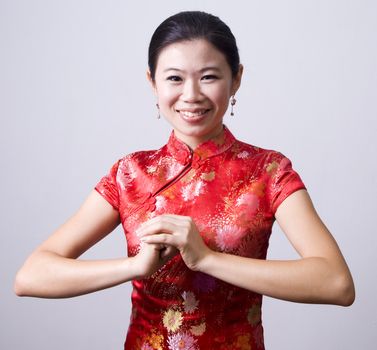 Oriental girl wishing you a happy chinese new year 