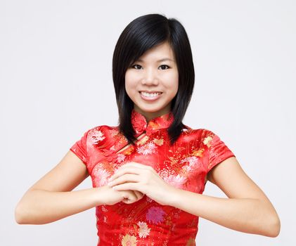 Oriental girl wishing you a happy Chinese New Year. 