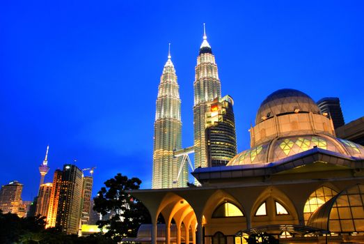 Famous Asy-Syakirin Mosque with Petronas Towers at the background, Kuala Lumpur, Malaysia 
