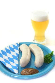 veal sausage with sweet mustard on a white background