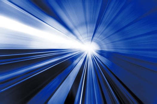 Motion fast in tunnel, focus on ground. Strong light from front. 
