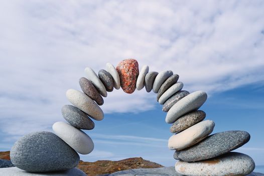 Red stone in the center arc of pebbles