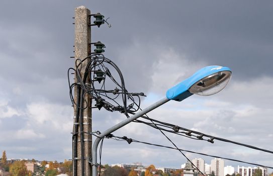 electric light pole, in the background the city