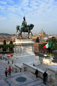 A view from just inside, under the tall Corinthian columns, of the equestrian sculpture of Vittorio Emanuele ll, in Rome, Italy.
