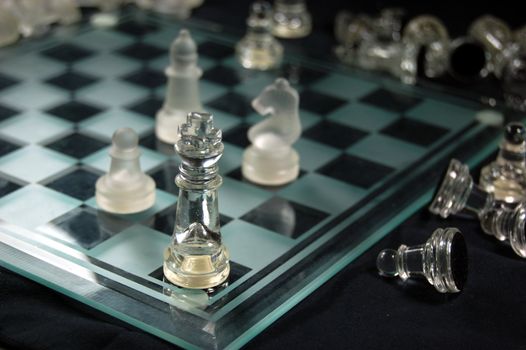 Set of glass chess, mate on the board