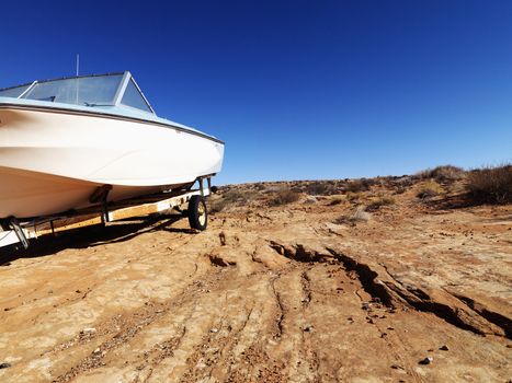 Landscape of motorboat sitting in the middle of the desert in rural Arizona, United States.