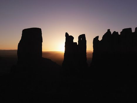 Scenic sunset landscape of mesas in Monument Valley near the border of Arizona and Utah, United States.