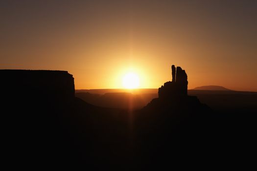 Scenic sunset landscape of mesas in Monument Valley near the border of Arizona and Utah, United States.