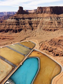 Aerial landscape of tailing ponds for mineral waste in rural Utah, United States.