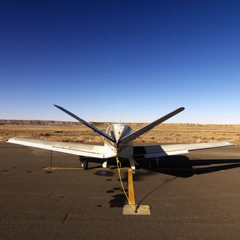Plane parked on tarmac at Canyonlands Field Airport, Utah, United States.