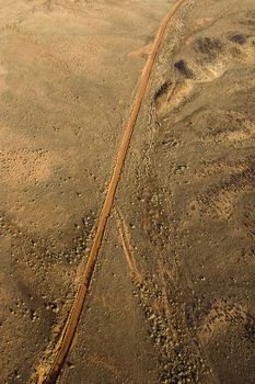 Aerial landscape of rural dirt road in Utah, United States.
