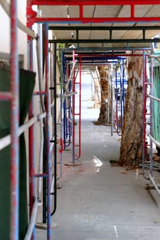 Scaffolding over a sidwalk for protecting pedestrian from the construction side