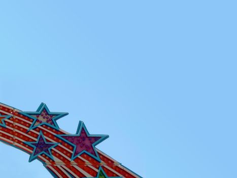 Lights in the form of stars on a ride at a fair.