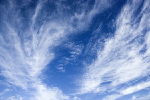 Beautiful blue sky with light wispy clouds.