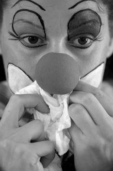 sad sick clown in black and white
