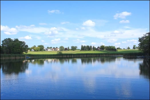 Country Pond View From Shore In Morning Sun