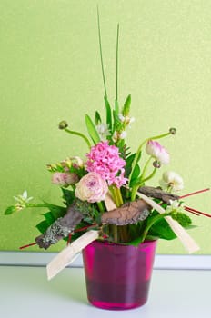 bunch of flowers composition at pot on a table