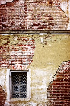 Wall in style grunge with a window in a curly grid