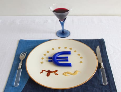 the symbol of Europe's economic position on a plate, a reference to the current economic problems of Europe, how will you it eat?