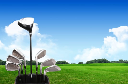 A set up new golf clubs on a beautiful golf course