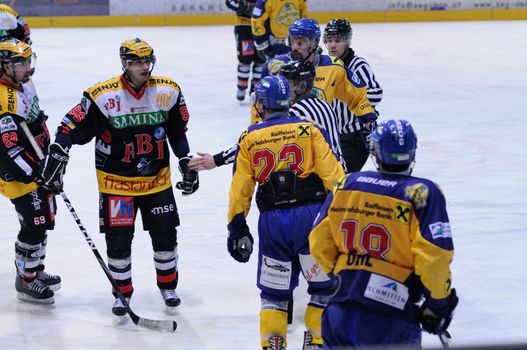 ZELL AM SEE, AUSTRIA - FEB 22: Austrian National League. Ullrich of EKZ trying to instigate fight. Game EK Zell am See vs. VEU Feldkirch (Result 3-1) on February 22, 2011 at hockey rink of Zell am See