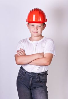 Portrait of a boy in a red protective helmet