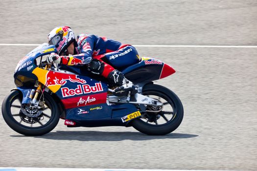 JEREZ DE LA FRONTERA, SPAIN - MAR 5:125cc pilot Jonas Folger races on the official training of the world championship of MotoGP on Mar 5, 2011, in Jerez de la Frontera, Spain