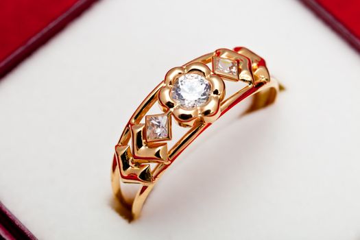 Fantastic gold ring adorned with several white zirconia