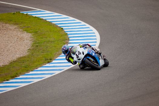 JEREZ DE LA FRONTERA, SPAIN - NOV 20: Stock Extreme motorcyclist Arturo Tizon takes a curve in the CEV championship on Nov 20, 2010, in Jerez de la Frontera, Spain