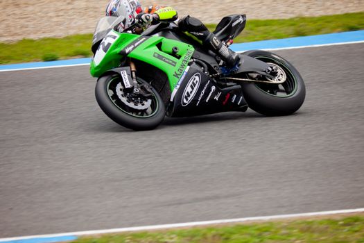JEREZ DE LA FRONTERA, SPAIN - NOV 20: Stock Extreme motorcyclist Oscar Ibañez takes a curve in the CEV championship on Nov 20, 2010, in Jerez de la Frontera, Spain