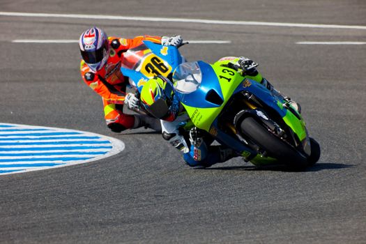 JEREZ DE LA FRONTERA, SPAIN - APR 17: Moto2 motorcyclists Renaud Binoche and Juan David Lopez takes a curve in the CEV Championship race on April 17, 2011 in Jerez de la Frontera, Spain.