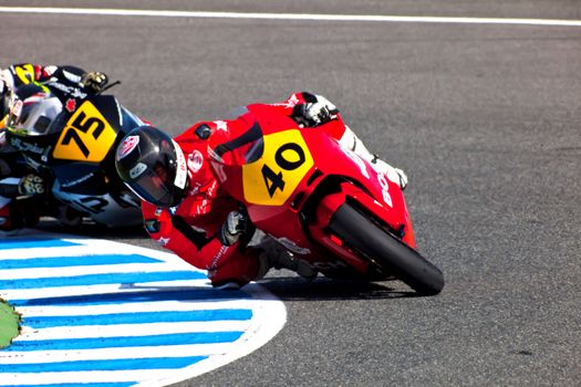 JEREZ DE LA FRONTERA, SPAIN - APR 17: Moto2 motorcyclist Roman Ramos and Tomoyoshi Koyama takes a curve in the CEV Championship race on April 17, 2011 in Jerez de la Frontera, Spain.