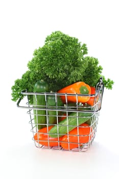 a shopping basket filled with colorful vegetables