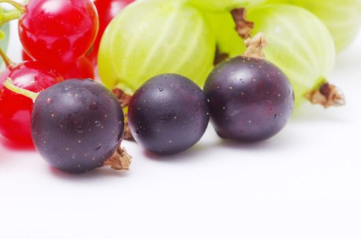 Fresh delicious summer berries isolated on white