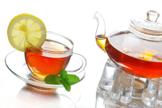 Tea being poured into glass tea cup