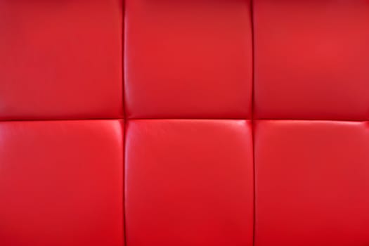 Covering of furniture with bright red artificial material