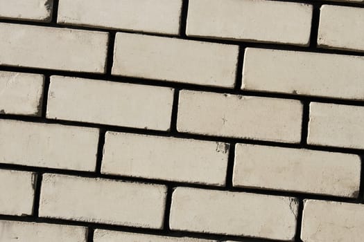 Detail of wall with light bricks. Contrast texture