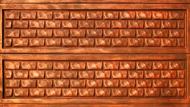 Detail of decorative concrete plate fence covered with ornamental pattern