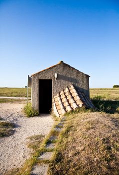 Tarquinia, Italy. This is the entrance of an Etruscan tomb (around 470 B.C.) Via a narrow corridor leading downstair one has access to the rectangular burial.