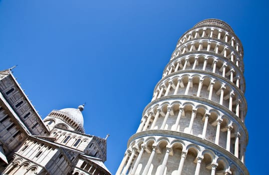 Italy - Pisa. The famous leaning tower on a perfect blue bakcground