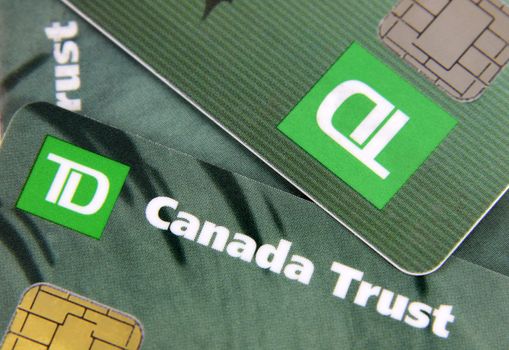Toronto, Ontario, Canada - July 2, 2011: A closeup of three TD Canada Trust bank cards.  TD Canada Trust is one of the biggest banks in Canada.  They also operate internationally.
