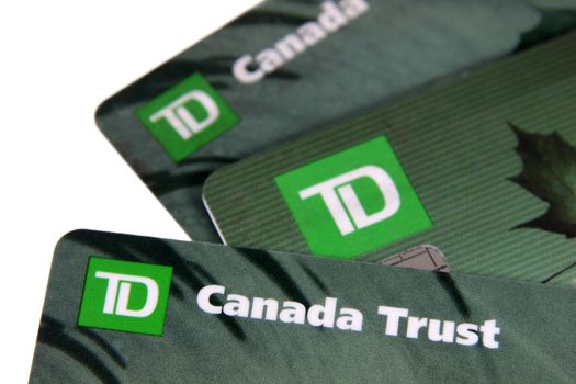 Toronto, Ontario, Canada - July 2, 2011: A closeup of three TD Canada Trust bank cards.  TD Canada Trust is one of the biggest banks in Canada.  They also operate internationally.