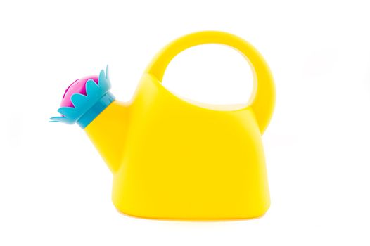 Yellow watering can isolated on white