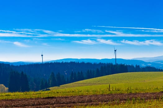 Farmland, forest and wind turbines in Black Forest, rural Germany.