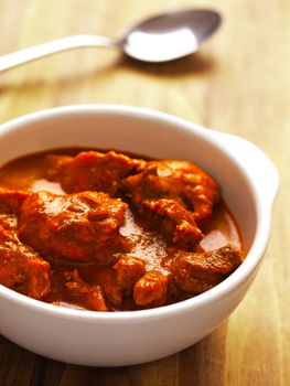 close up of a bowl of indian mutton curry