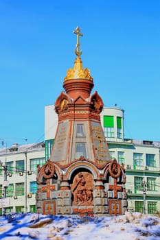 chapel-monument of brick in the center of Moscow with amazing 
architecture photographed in winter