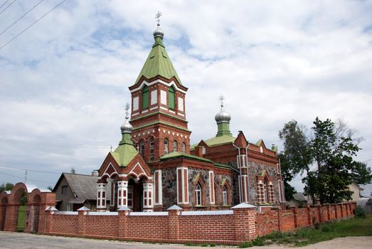 Estonia. Beautiful operating church on a background of the sky and clouds