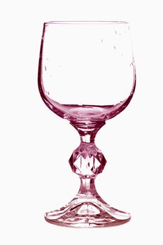 Empty wine glass in red tones isolated over white
